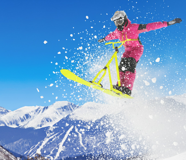 person flying high on a ski bike. Cuchara Mountain Park Year-Round Fun, Nonprofit Outdoor Recreation Huerfano County, Expanded Hiking and Biking Trails Cuchara, Cuchara Tubing Hills, Outdoor Education Programs Youth Colorado, Cuchara Mountain Park Volunteer Donate, Future of Nonprofit Skiing Colorado