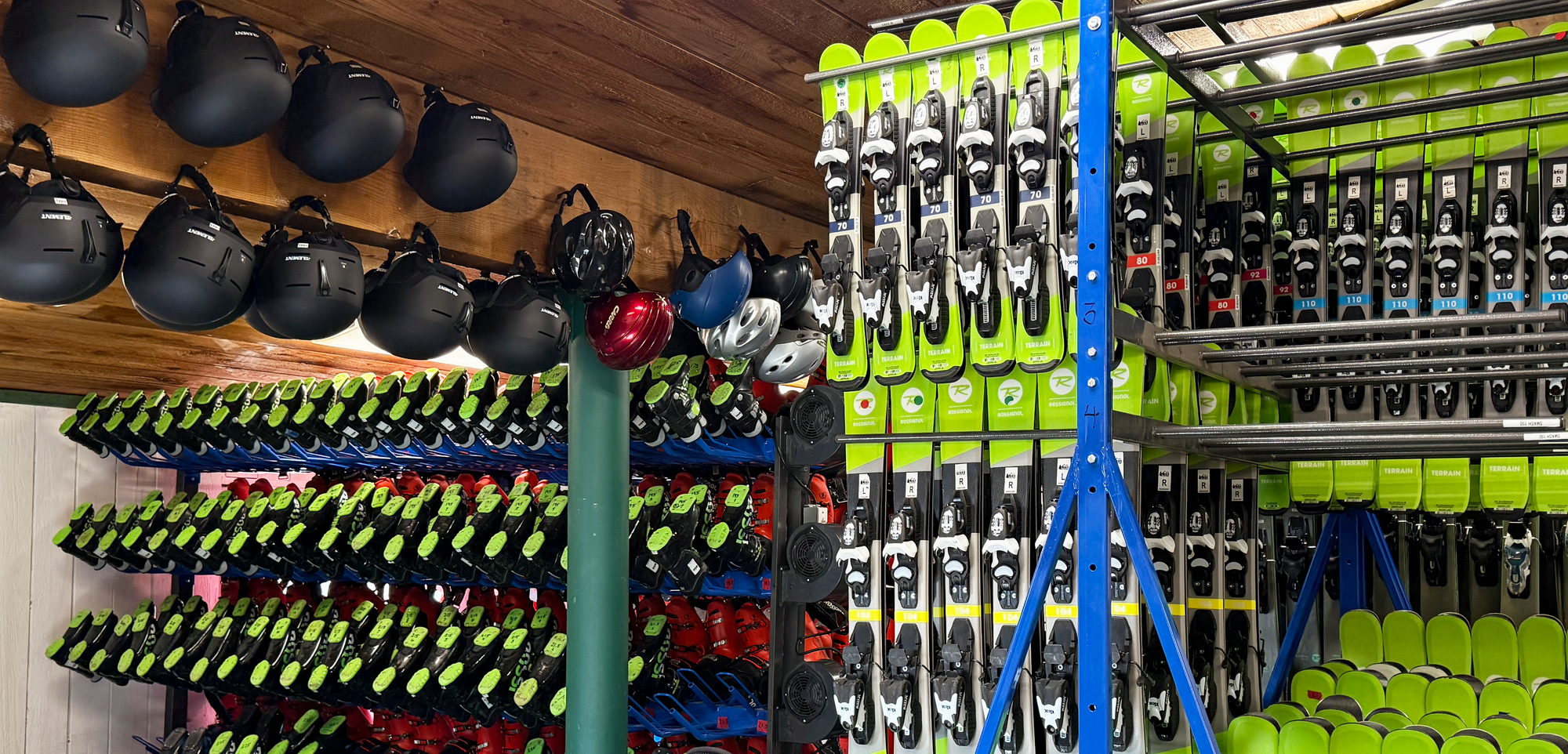 Storage room with ski equipment including skis, boots, and helmets.  Cuchara Mountain Park ski rentals, snowboard rentals Cuchara Colorado, ski gear rental Cuchara, Cuchara Mountain Park winter sports rentals, affordable ski rentals Southern Colorado, kids ski and snowboard rentals Cuchara, best place to rent skis near Cuchara Mountain Park, full day ski equipment packages Cuchara, helmet and gear rentals Cuchara Mountain, ski rental shop near La Veta CO, ski rentals near La Veta Colorado, winter sports