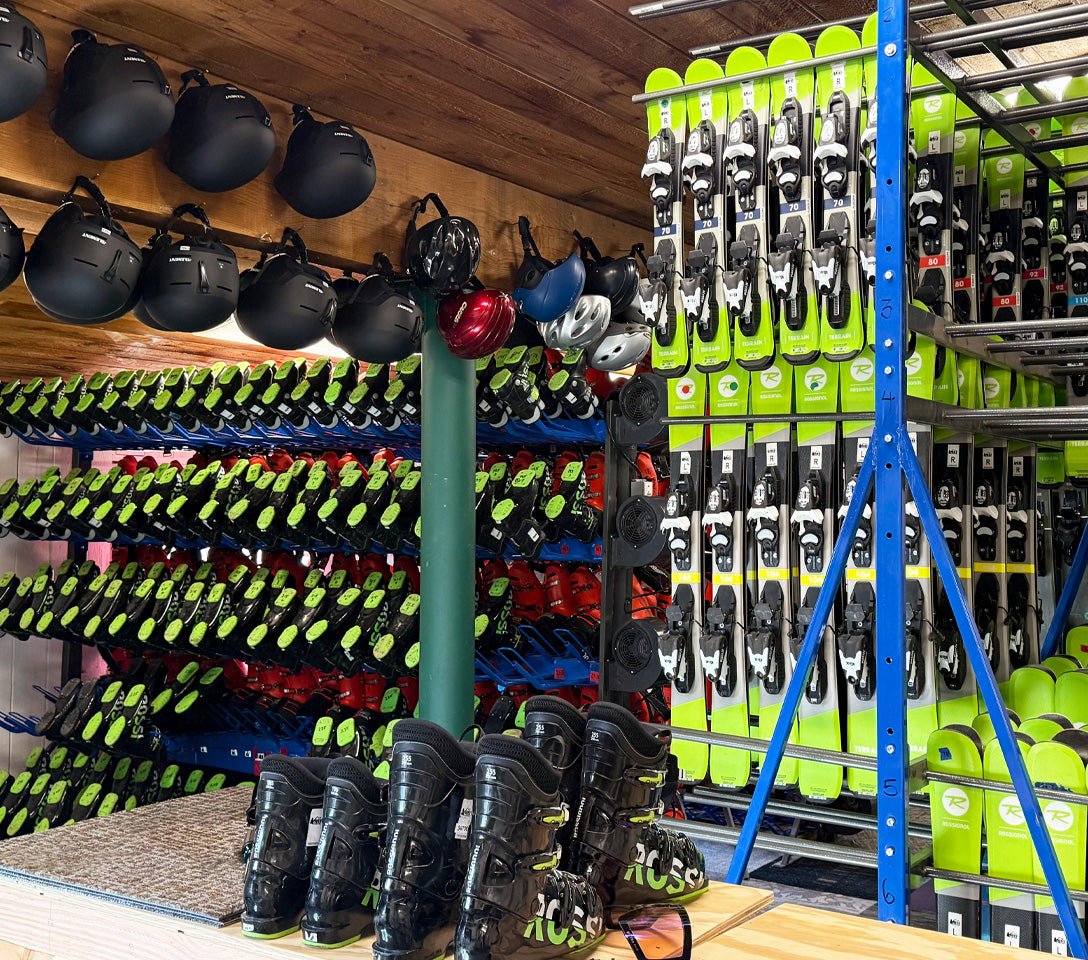 Storage room with ski equipment including skis, boots, and helmets.  Cuchara Mountain Park ski rentals, snowboard rentals Cuchara Colorado, ski gear rental Cuchara, Cuchara Mountain Park winter sports rentals, affordable ski rentals Southern Colorado, kids ski and snowboard rentals Cuchara, best place to rent skis near Cuchara Mountain Park, full day ski equipment packages Cuchara, helmet and gear rentals Cuchara Mountain, ski rental shop near La Veta CO, ski rentals near La Veta Colorado, winter sports