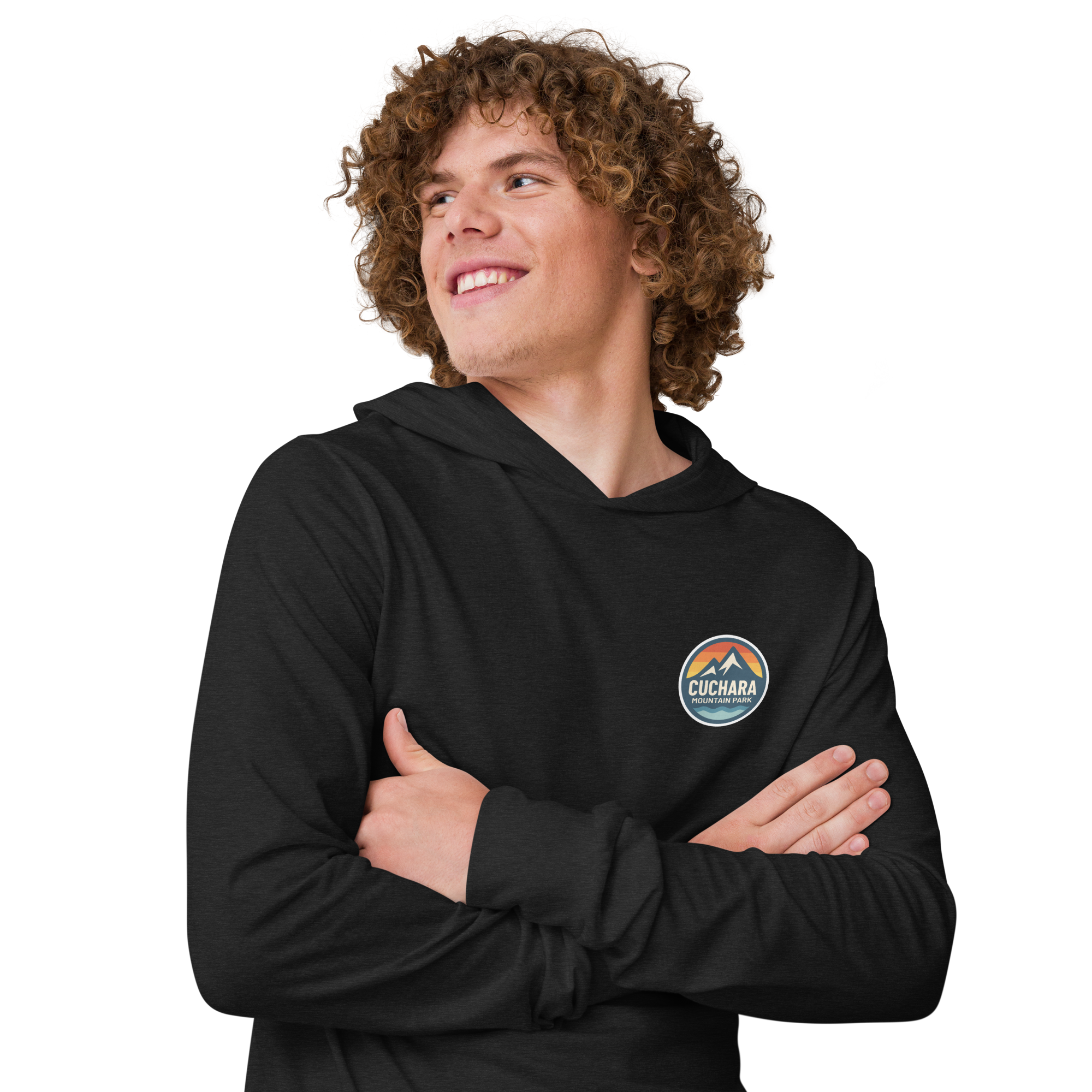 Person wearing a black hoodie with 'Cuchara Mountain Park' logo in a snowy mountain landscape.  Person wearing a black hoodie with a logo against a snowy mountain landscape.  lightweight long-sleeve hooded tee, unrestricted movement shirt, all-season layering top, comfortable athletic fit, stylish outdoor outfit, year-round trail essential, men's hooded t-shirt, cuchara mountain park hoodie, cuchara mountain park long sleeve shirt